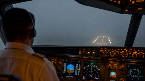 Pilot flying an instrument approach in dense fog